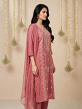 Woman wearing a dusty rose embroidered kurta set with dupatta