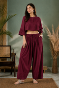 Maroon farshi salwar side view showing wide flare and pocket