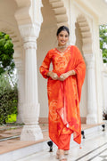 Close-up of orange kurta with mirror-style neckline and circular motif