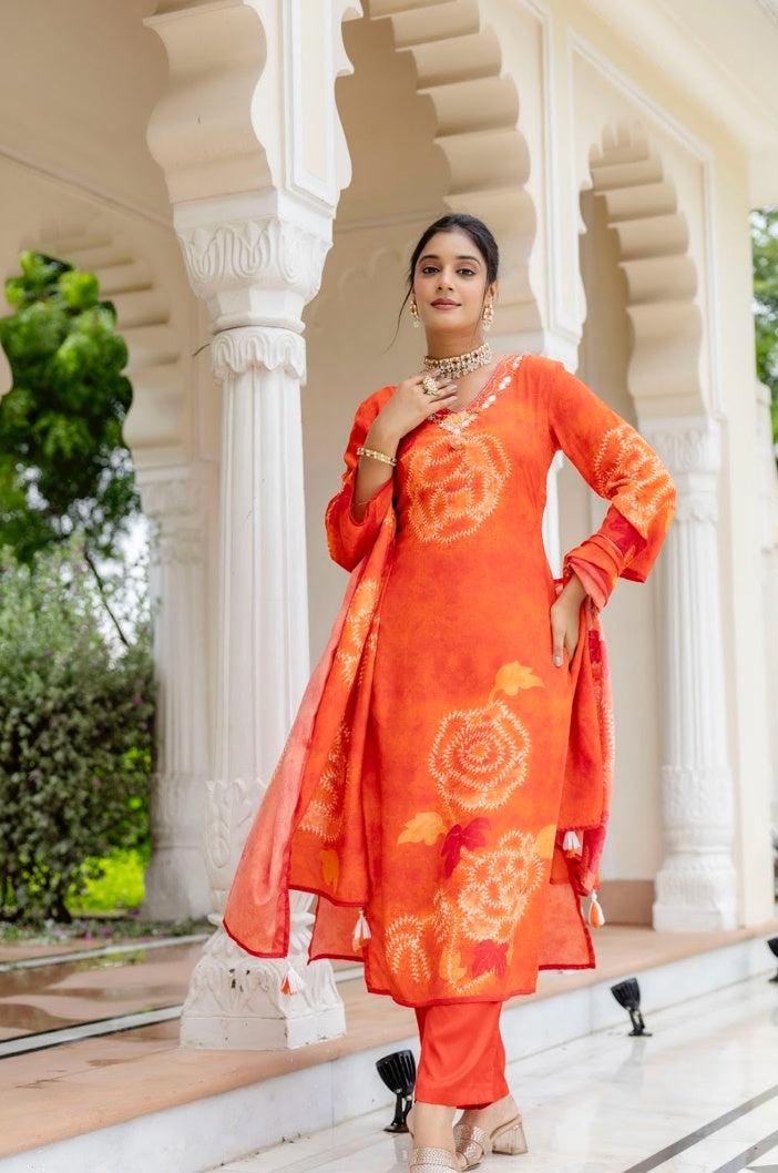 Full view of orange printed kurta set with trousers and matching dupatta