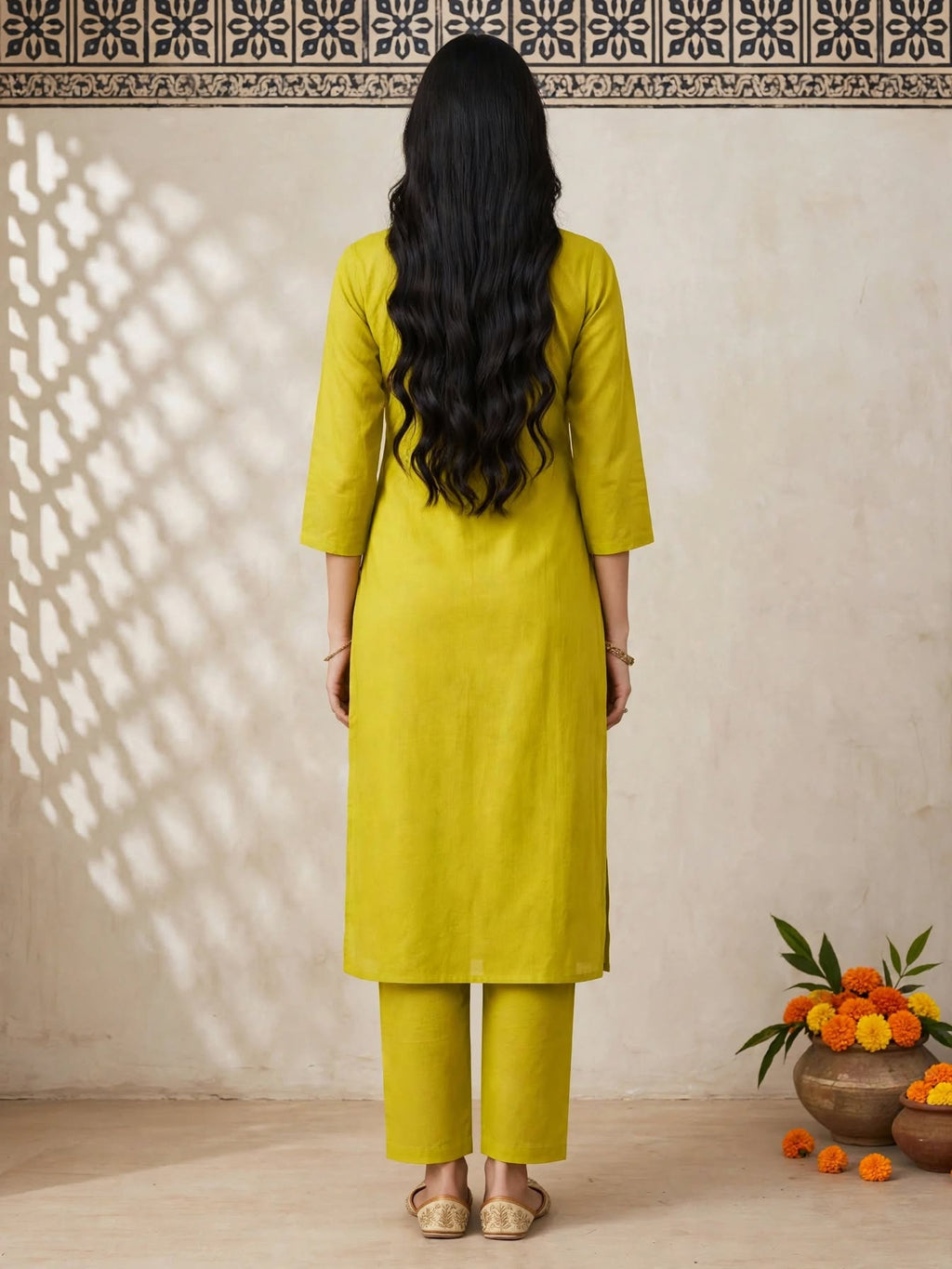 Back view of lime green straight-cut kurta and trousers