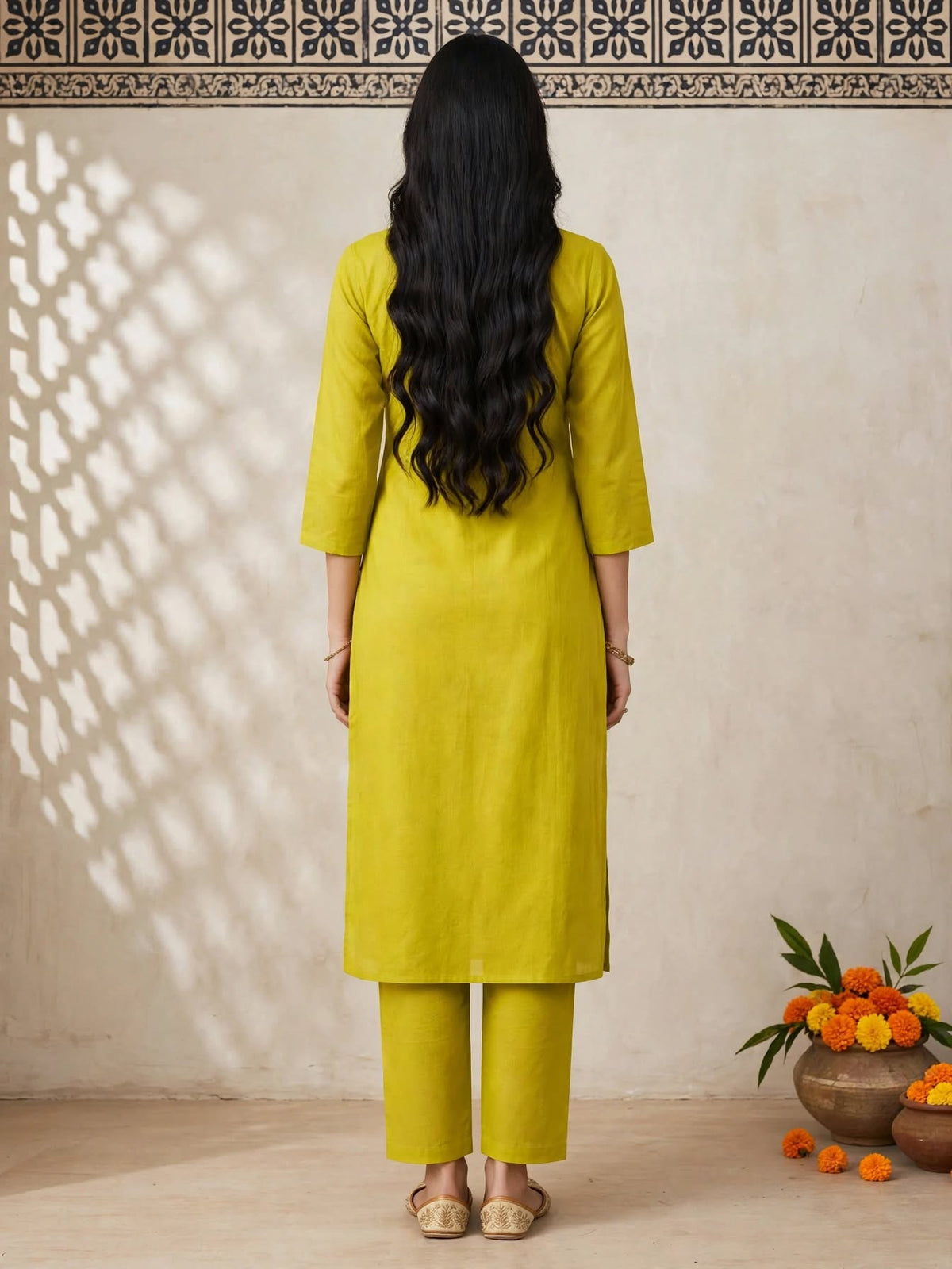 Back view of lime green straight-cut kurta and trousers
